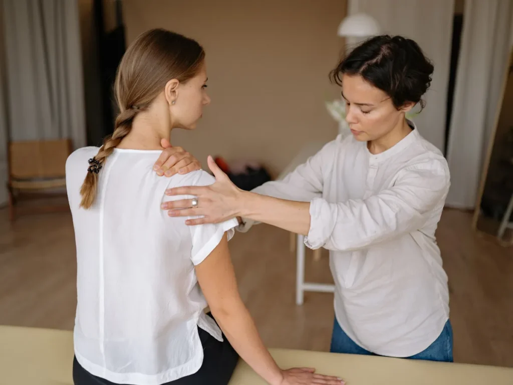 mobile massage therapist providing shoulder treatment in north london